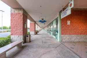 exterior hallway of shopping center with retail/office units for lease in Lancaster, CA