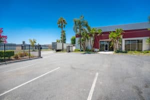 gated parking and exterior of building for sale in riverside, ca